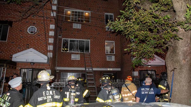 Firefighters outside of Lanesha Hayden's apartment building in Ozone Park, Queens.